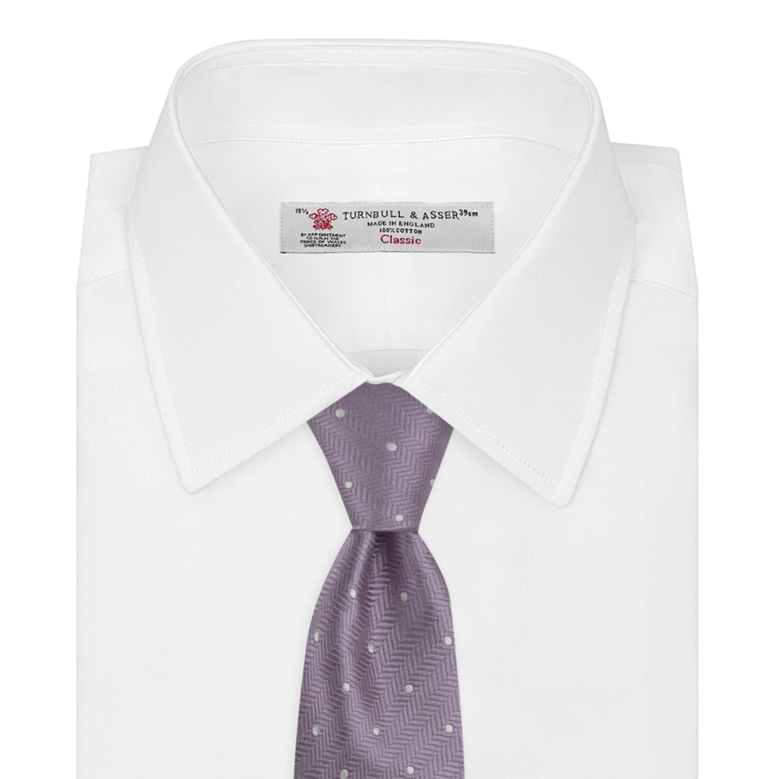 View 2 of product The Turnbull & Asser Lilac and White Small Spot Herringbone Silk Tie, crafted from fine English silk, is neatly rolled and displayed on a plain white background.