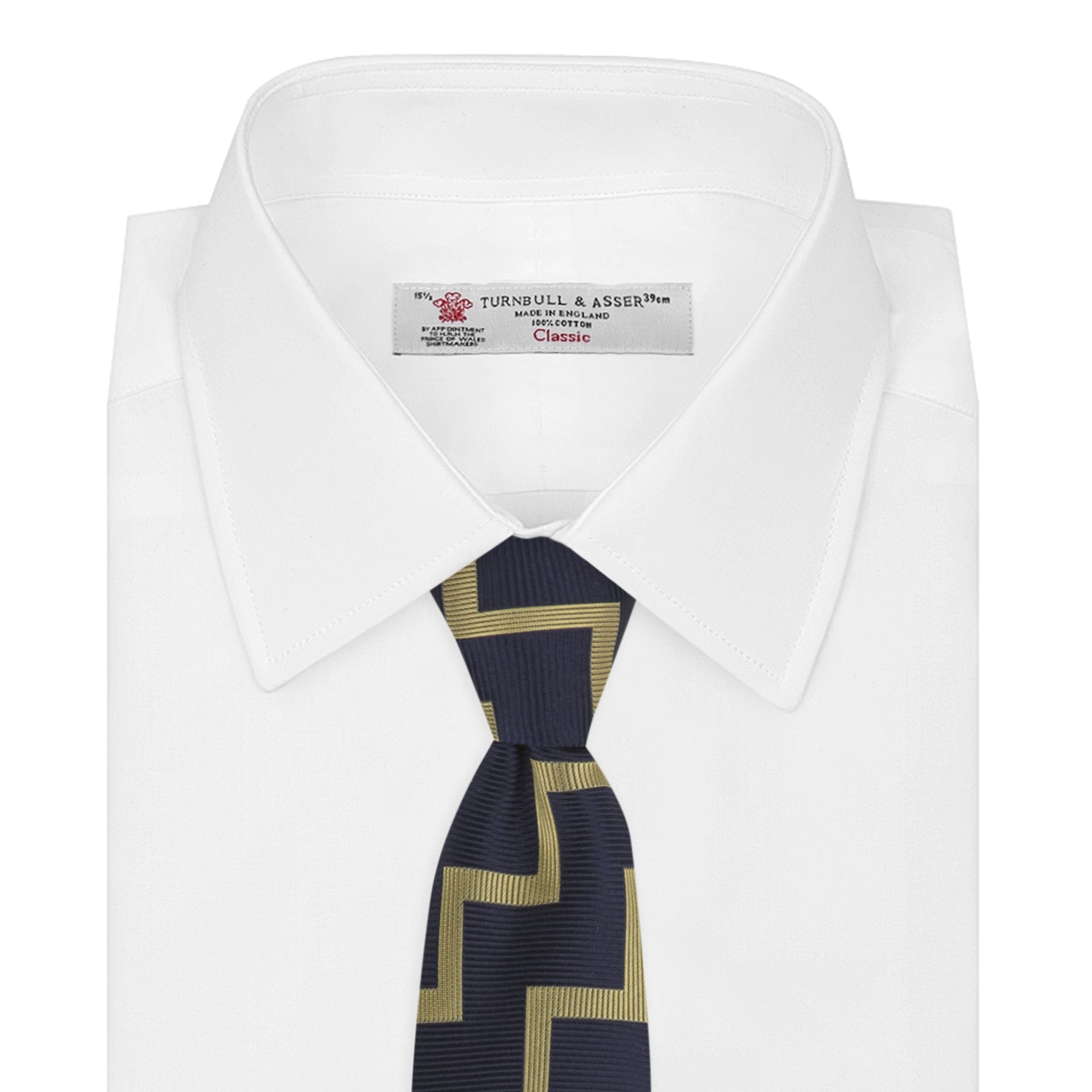 View 2 of product The Navy and Gold Striped Zigzag Silk Tie by Turnbull & Asser features a bold geometric pattern—an essential modern accessory shown rolled up with the pointed end forward on a white background.