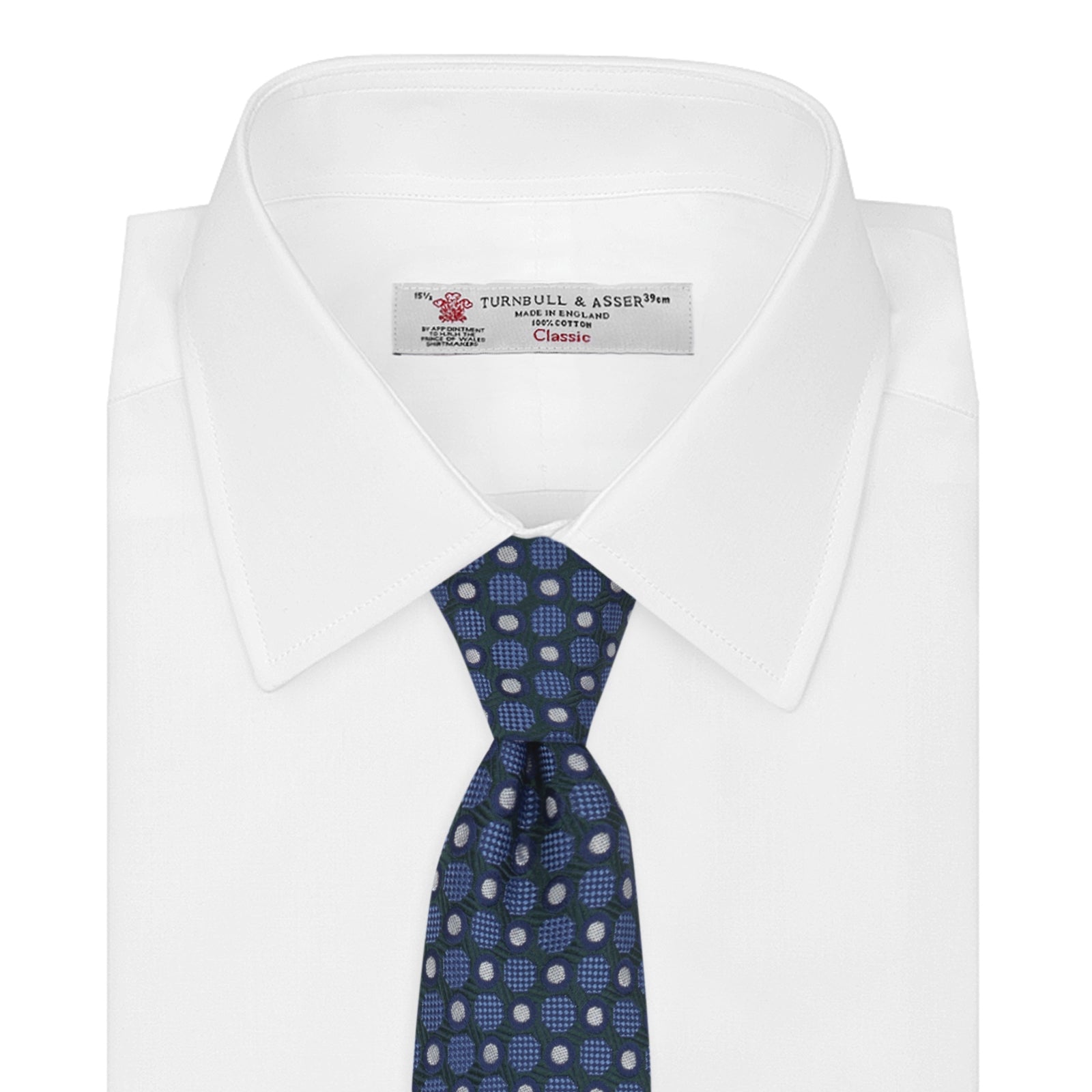 View 2 of product Turnbull & Asser’s Forest Green and Blue Circle and Spot Silk Tie, rolled on a white background, features a refined pattern—an elegant classic for any office shirt.