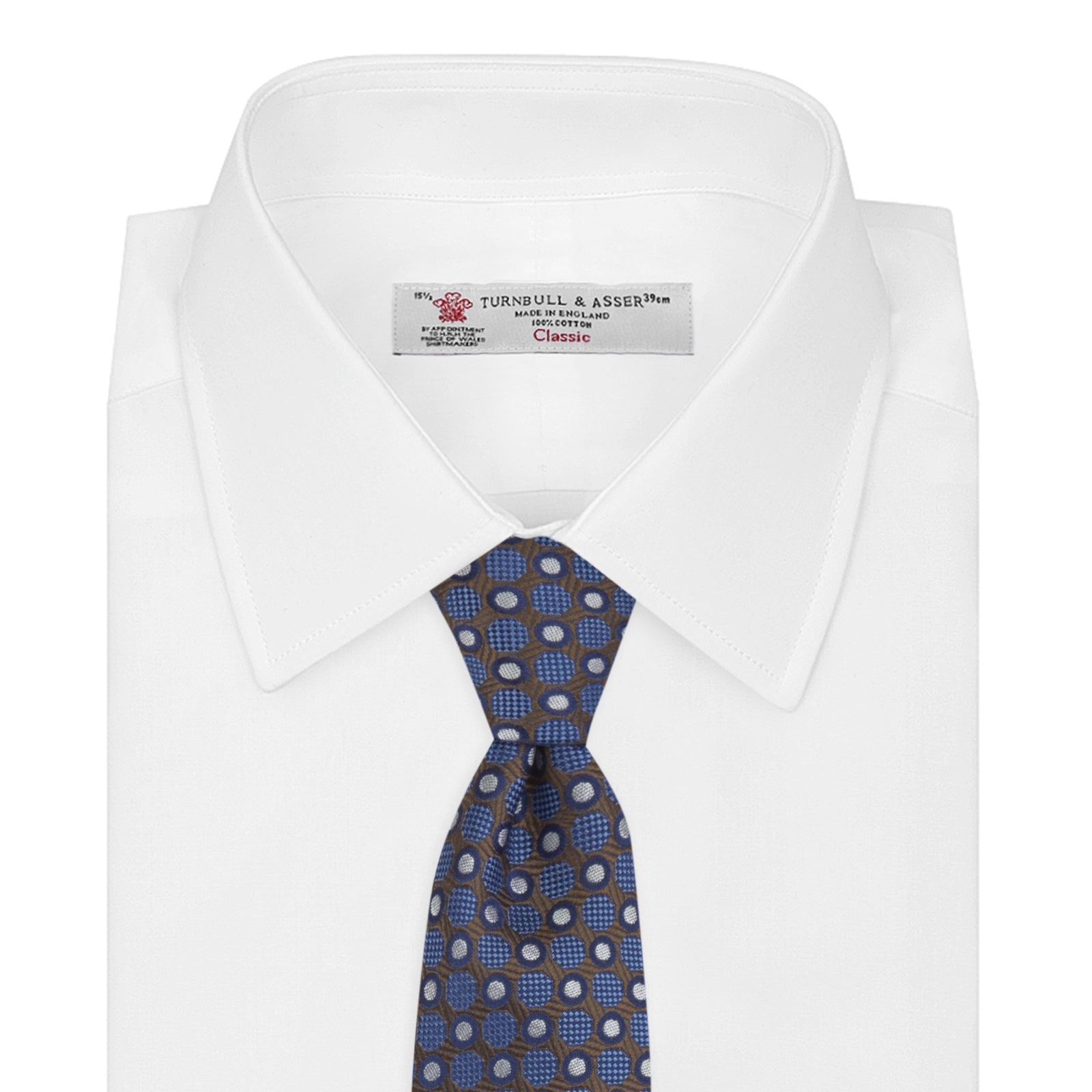 View 2 of product The Turnbull & Asser Brown and Blue Circle and Spot Silk Tie features a repeating pattern of brown and blue spots, ideal for office wear, shown on a white background.