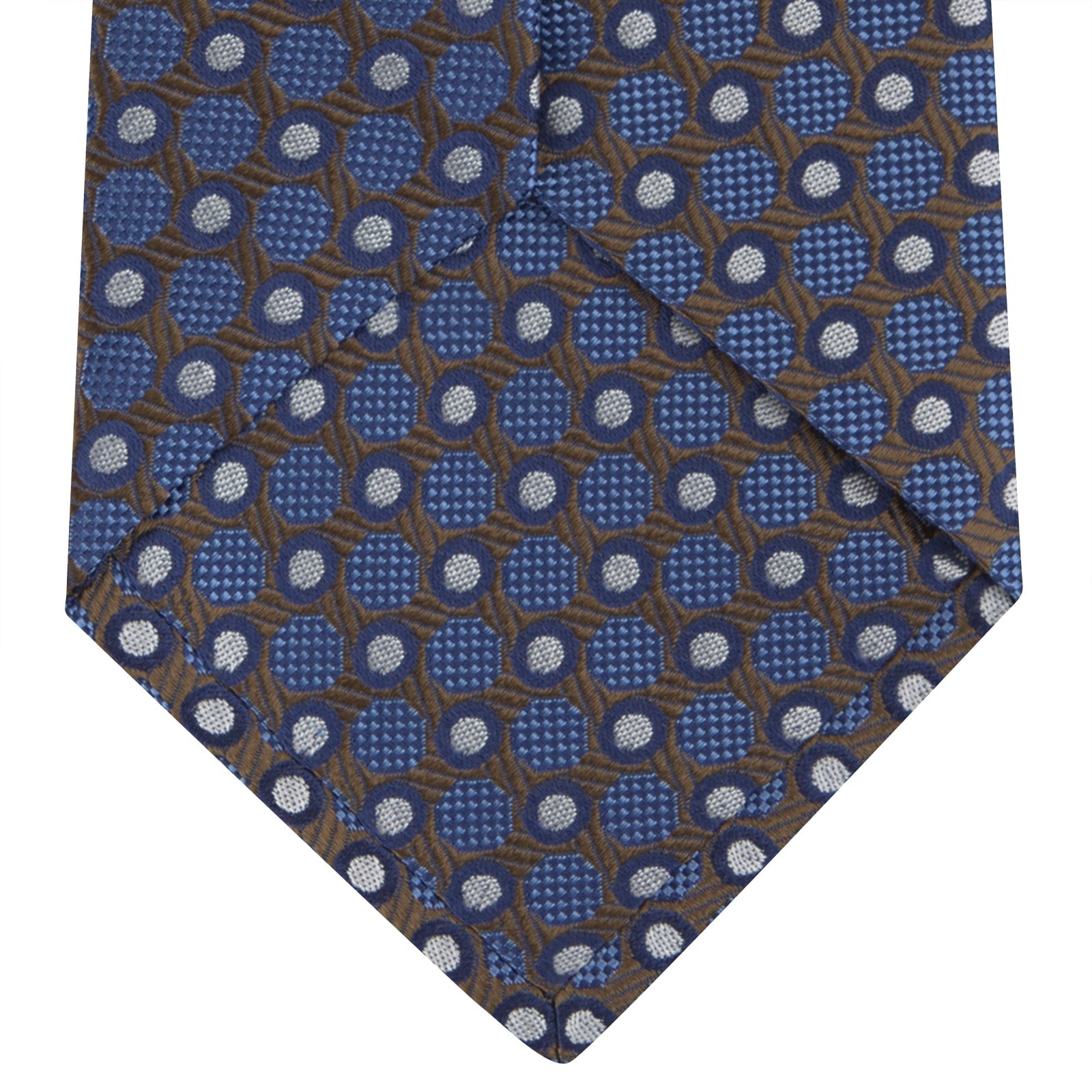 View 4 of product The Turnbull & Asser Brown and Blue Circle and Spot Silk Tie features a repeating pattern of brown and blue spots, ideal for office wear, shown on a white background.