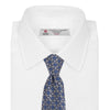 View 2 of product The Turnbull & Asser Silver and Blue Circle and Spot Silk Tie features a classic geometric pattern in silver and light blue on white, making it the perfect complement to any office shirt.