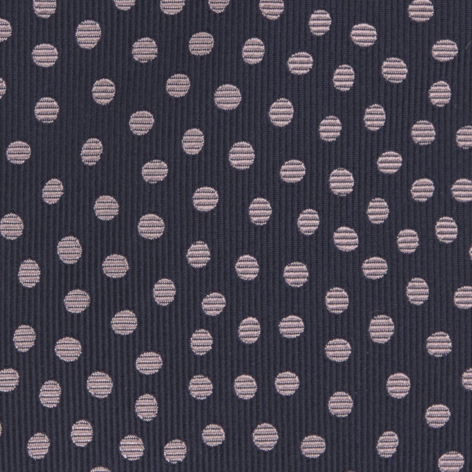 View 3 of product The Turnbull & Asser Navy and Pink Paint Spot Silk Tie, rolled at one end and set against a white background, adds a stylish touch to any office shirt with its modern spot pattern.