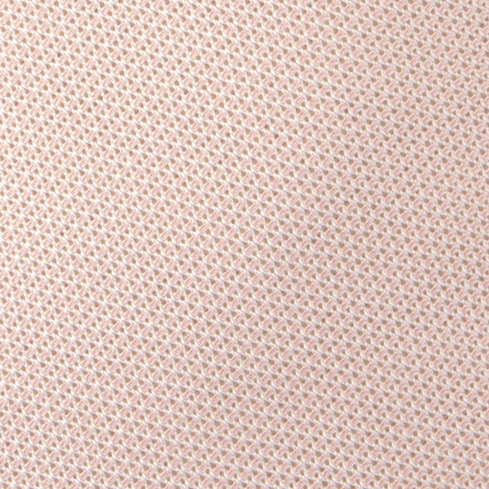 The Turnbull & Asser Light Pink Grenadine Silk Tie features a subtle woven pattern, shown rolled up on a plain white background.