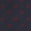 View 3 of product The Turnbull & Asser Navy and Burgundy Emblem Spot Silk Tie features a subtle textured pattern with small burgundy emblems on navy silk. Perfectly rolled with a pointed tip, it pairs well with any office shirt.