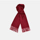 The Turnbull & Asser Bordeaux Pure Cashmere Scarf, in deep red with a soft texture and fringed ends, is neatly folded and displayed on a plain white background.
