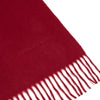 View 2 of product The Turnbull & Asser Bordeaux Pure Cashmere Scarf, in deep red with a soft texture and fringed ends, is neatly folded and displayed on a plain white background.