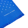 View 2 of product The Turnbull & Asser Royal Blue and White Spotted Silk Scarf features a soft silk fabric, short fringes at both ends, neatly folded center, and a hand-printed polka dot design for a distinctive, elegant look.