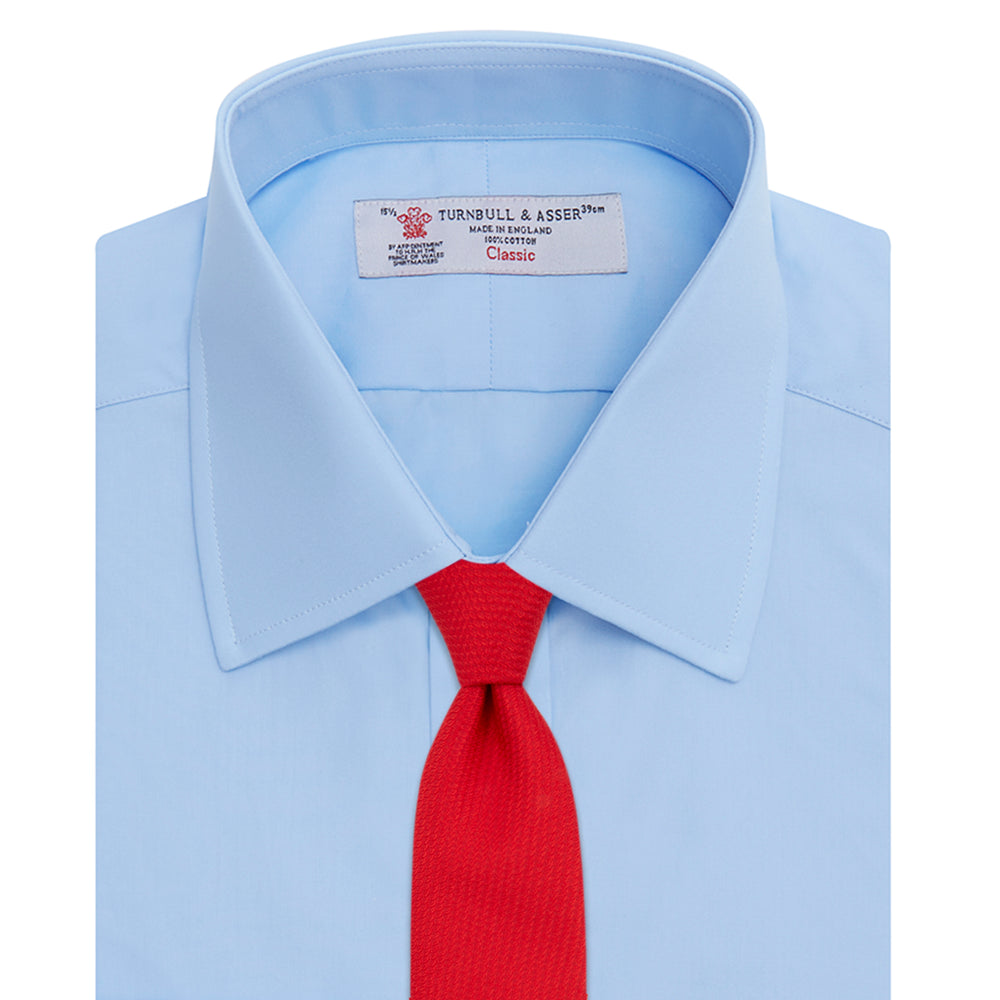 A Light Blue Cotton Shirt with T&A Collar and Double Cuffs by Turnbull & Asser, neatly folded and displayed on a plain white background.