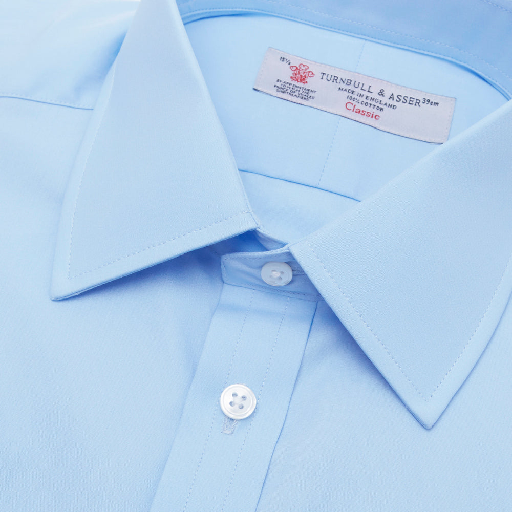 A Light Blue Cotton Shirt with T&A Collar and Double Cuffs by Turnbull & Asser, neatly folded and displayed on a plain white background.