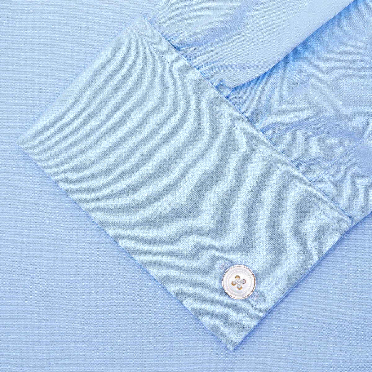 View 6 of product A Light Blue Cotton Shirt with T&A Collar and Double Cuffs by Turnbull & Asser, neatly folded and displayed on a plain white background.