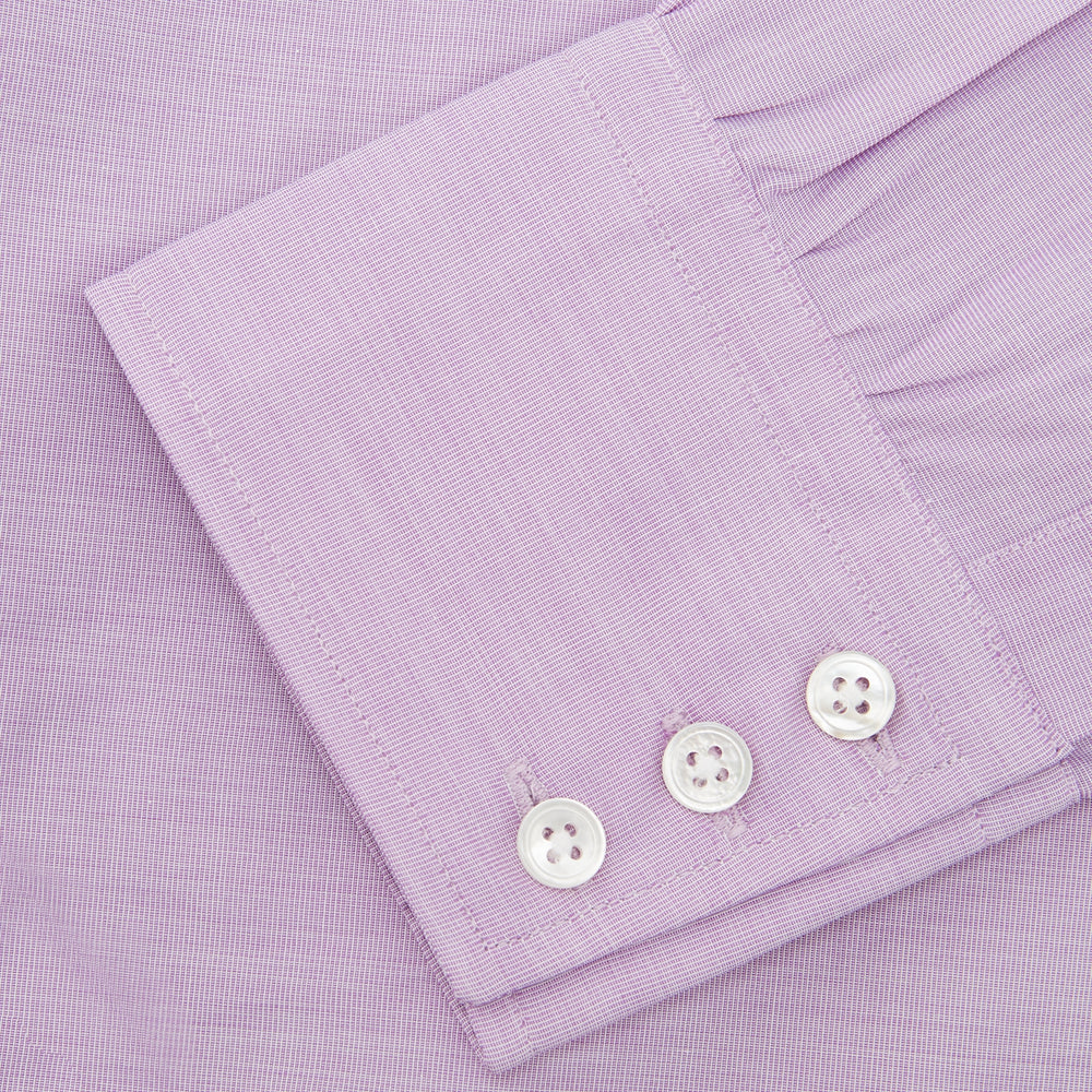 A neatly folded Turnbull & Asser Lilac End-on-End Shirt with T&A collar and 3-button cuffs, featuring white buttons and long sleeves, is displayed on a plain white background.