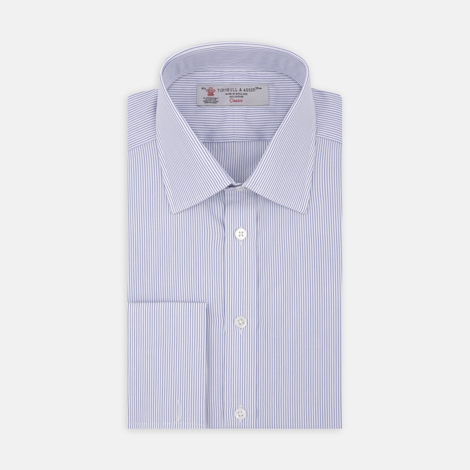 View 2 of product The Blue and White Fine Stripe Cotton Shirt by Turnbull & Asser features a T&A collar and double cuff, displayed neatly folded with white buttons against a plain white background.