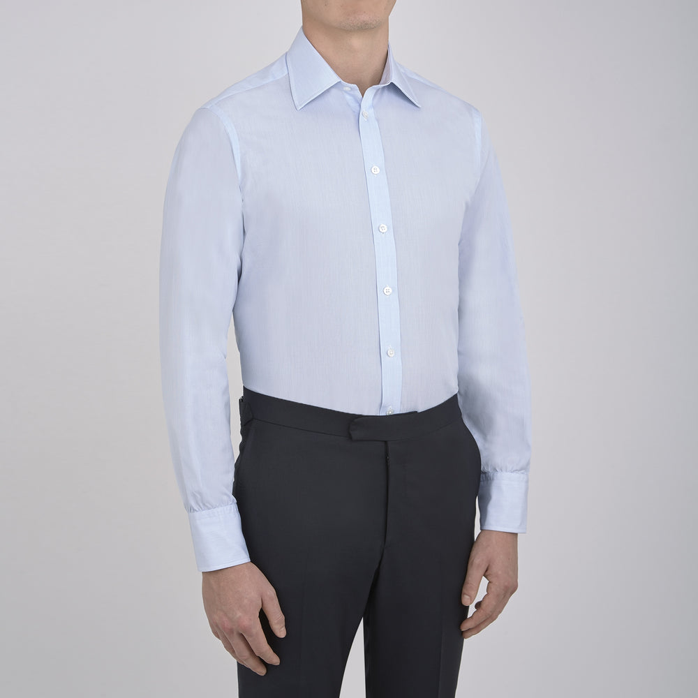 The Turnbull & Asser Light Blue Fine Check Shirt for men features a T&A collar, 3-button cuffs, classic white buttons, and a refined check design with a visible label inside the collar.