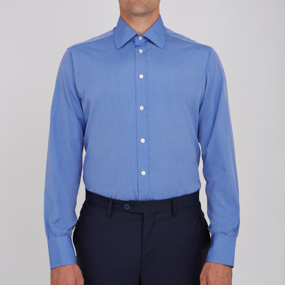 The Turnbull & Asser Dark Blue End-On-End Shirt features a T&A collar and 3-button cuffs, displayed neatly folded on a white background. Ideal for pairing with a navy suit, the label inside the collar is visible.
