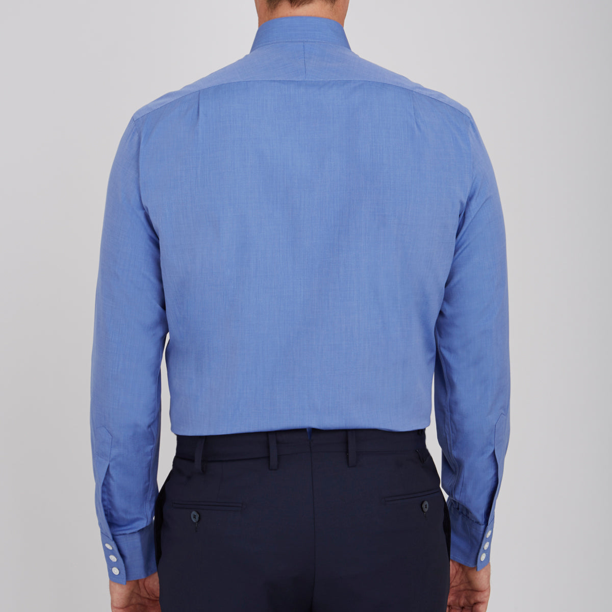 View 3 of product The Turnbull & Asser Dark Blue End-On-End Shirt features a T&A collar and 3-button cuffs, displayed neatly folded on a white background. Ideal for pairing with a navy suit, the label inside the collar is visible.
