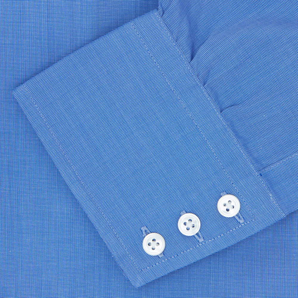The Turnbull & Asser Dark Blue End-On-End Shirt features a T&A collar and 3-button cuffs, displayed neatly folded on a white background. Ideal for pairing with a navy suit, the label inside the collar is visible.