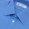 View 5 of product A neatly folded, dark blue end-on-end men's dress shirt by Turnbull & Asser, featuring a T&A collar and double cuffs, is displayed against a plain white background.