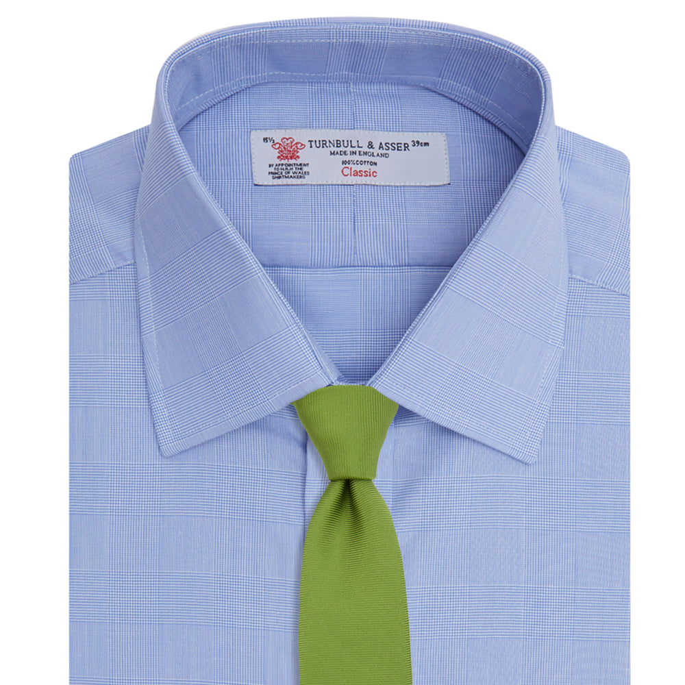 The Turnbull & Asser Blue Prince of Wales Check Shirt features a T&A collar and double cuffs, shown against a white background—ideal for timeless, minimalist style.