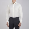 View 2 of product The Turnbull & Asser Cream Herringbone Superfine Cotton Shirt features a T&A collar and 3-button cuffs, ideal for minimalist style or bold ties, shown neatly folded against a plain white background.
