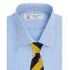 View 4 of product The Turnbull & Asser Blue Herringbone Superfine Cotton Shirt features a T&A collar and double cuffs—an essential for discerning gentlemen—shown folded on a plain white background.