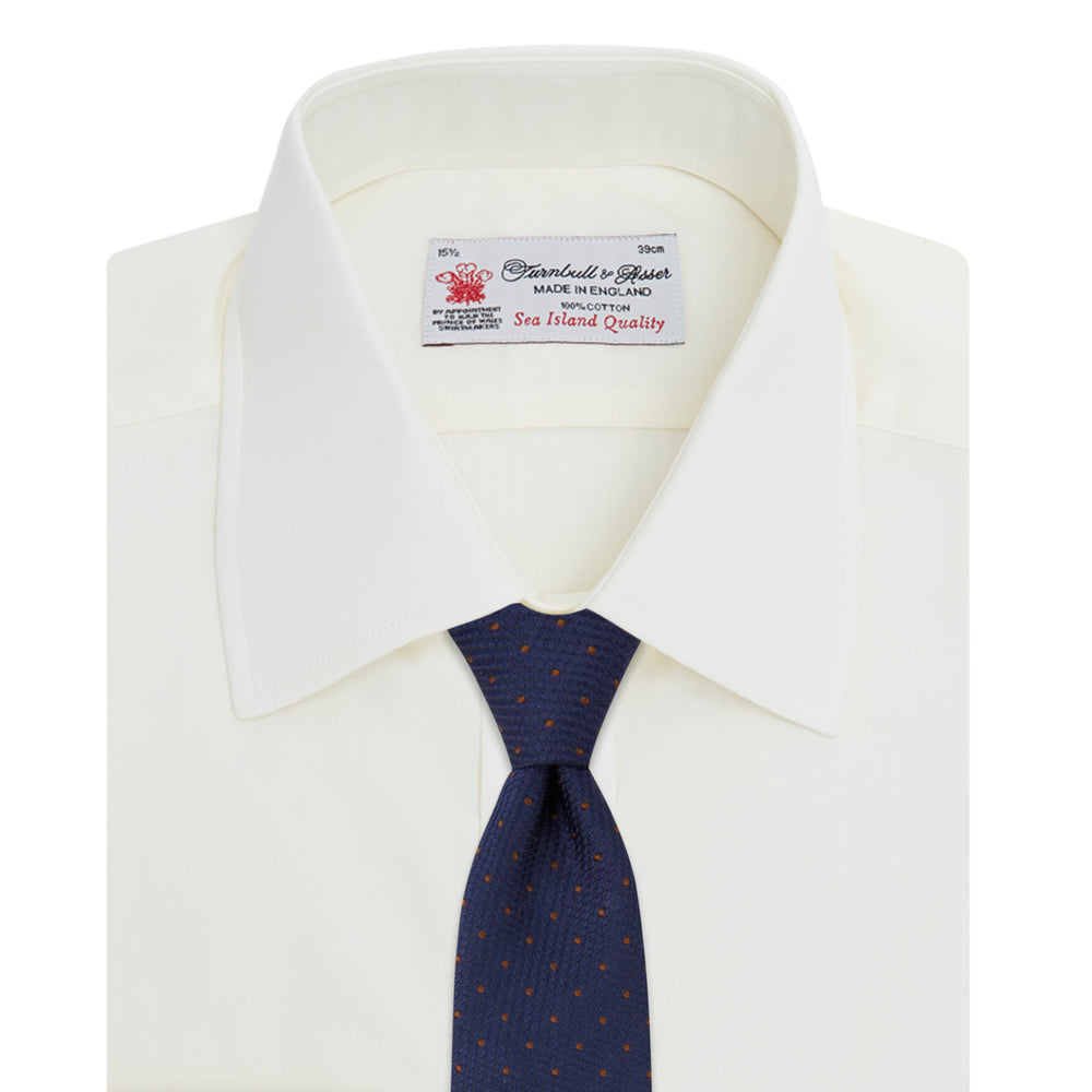 The Cream Sea Island Quality Cotton Shirt by Turnbull & Asser features a T&A collar and 3-button cuffs, crafted from premium cotton and displayed neatly folded against a plain white background.
