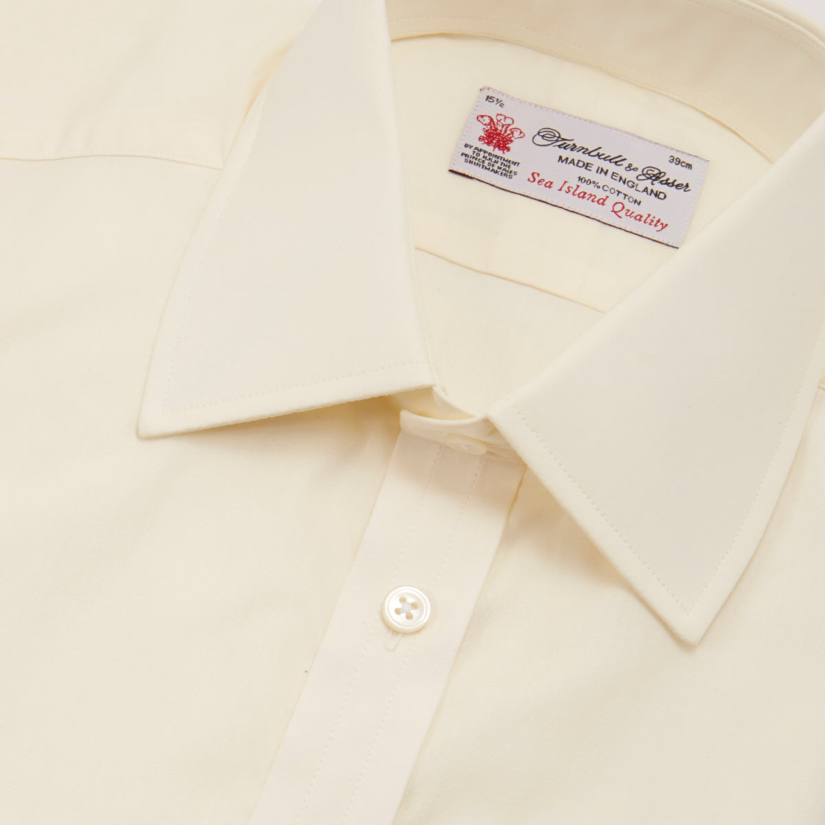 View 5 of product The Cream Sea Island Quality Cotton Shirt by Turnbull & Asser features a T&A collar and 3-button cuffs, crafted from premium cotton and displayed neatly folded against a plain white background.