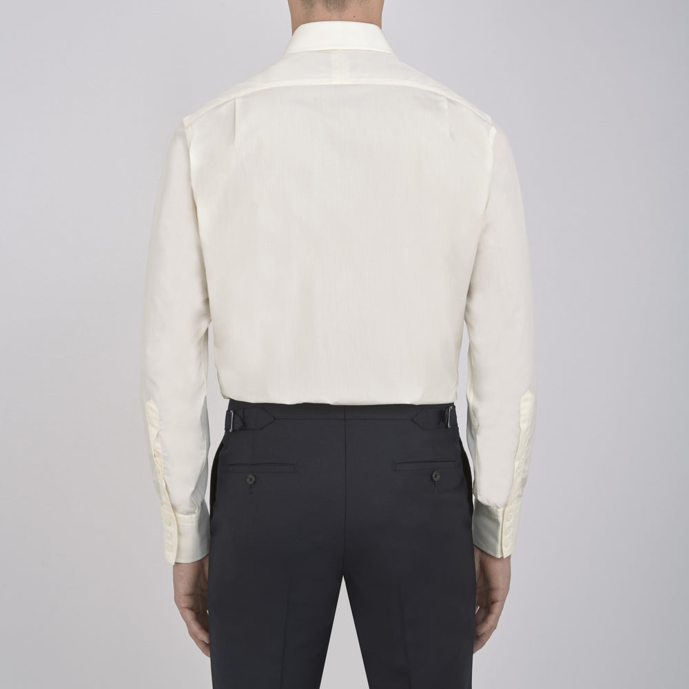 The Cream Sea Island Quality Cotton Shirt by Turnbull & Asser features a T&A collar and 3-button cuffs, crafted from premium cotton and displayed neatly folded against a plain white background.