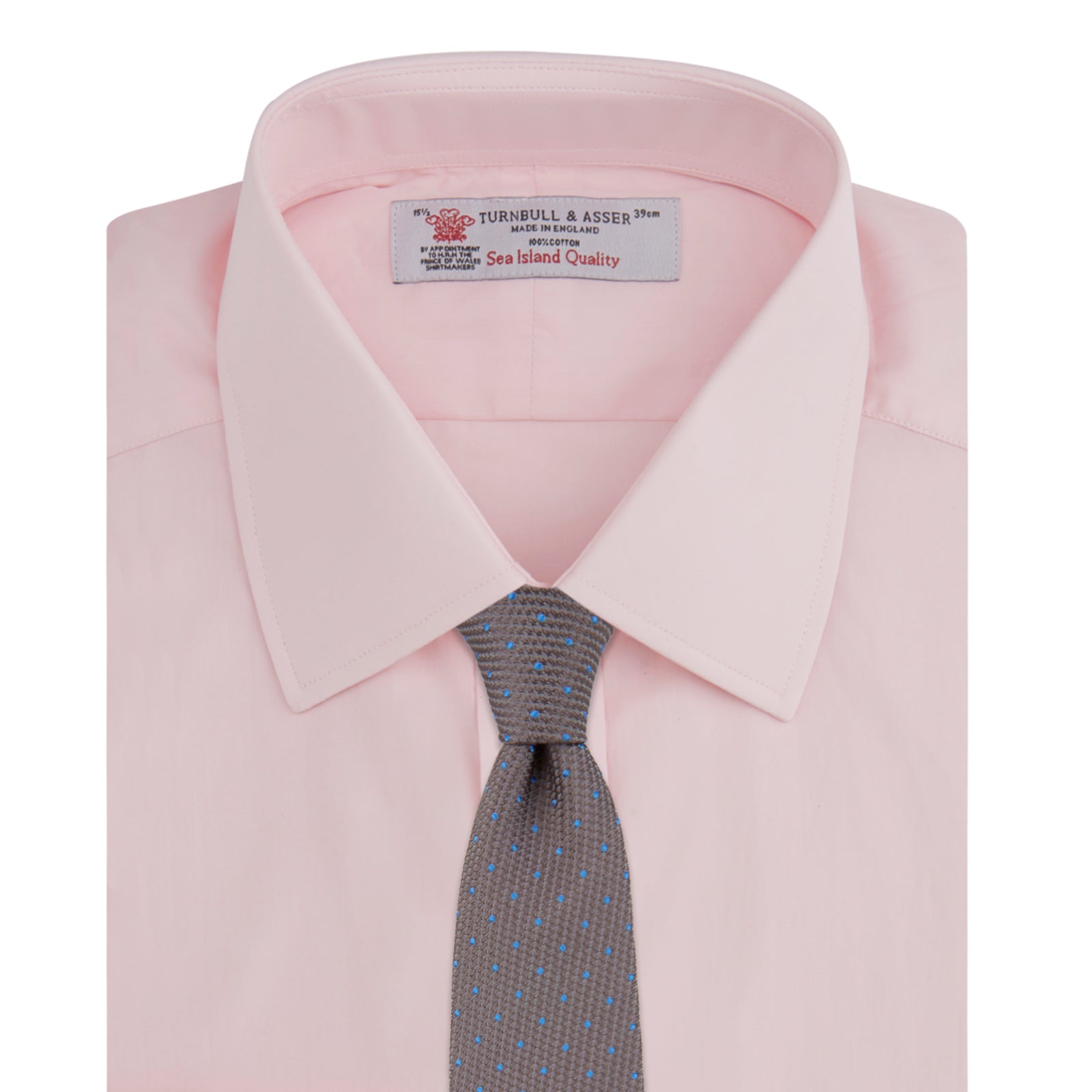 View 4 of product A slim black herringbone silk tie by Turnbull & Asser is paired with a neatly folded light pink long-sleeve dress shirt with a classic collar and white buttons, all displayed on a plain white background.