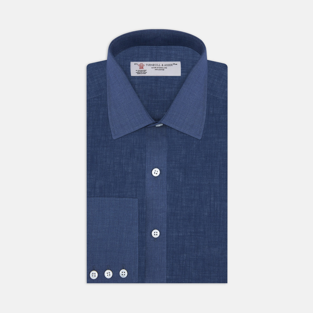 The Turnbull & Asser Navy Linen Shirt features a T&A collar, long sleeves, and 3-button cuffs, making it a stylish summer essential. Displayed neatly folded against a plain white background.