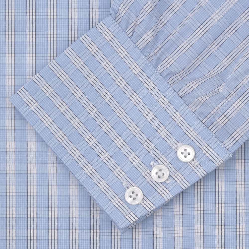 The Turnbull & Asser Blue and White Bold Check Shirt features a T&A collar, 3-button cuffs, and a classic plaid in blue and white, neatly folded with white buttons, displayed on a plain white background.