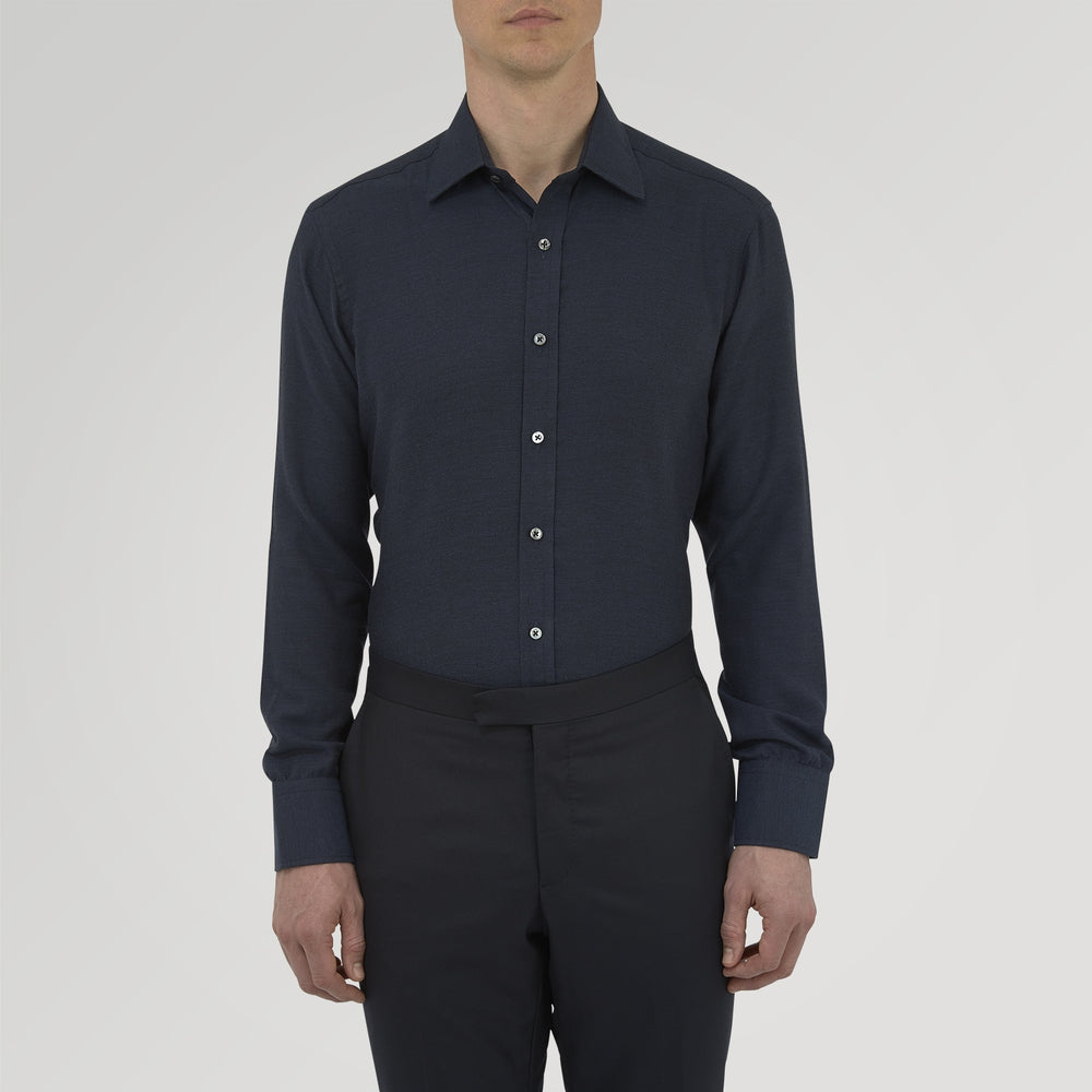 A navy cashmere blend Turnbull & Asser shirt with a T&A collar and 3-button cuffs, neatly folded and displayed against a plain white background.