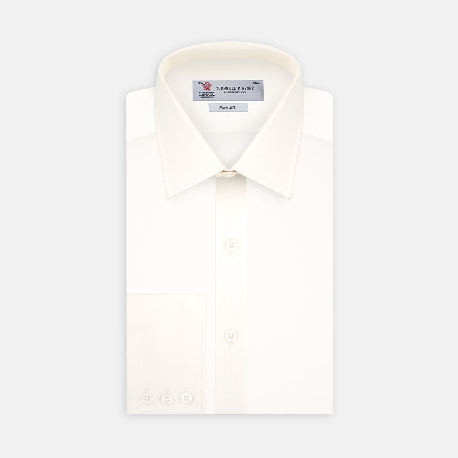View 1 of product The Cream Silk Shirt by Turnbull & Asser features a T&A collar and 3-button cuffs, displayed folded on a light background—perfect for sophisticated evening wear.