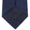 View 4 of product The Navy Paisley Silk Tie by Turnbull & Asser is a classic men's accessory in blue and black, adding sophistication to any look.