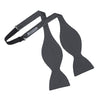 View 3 of product The Turnbull & Asser Diamond Black and White Silk Bow Tie features a black woven silk design with a tessellated diamond pattern of small white shapes, shown against a plain white background.