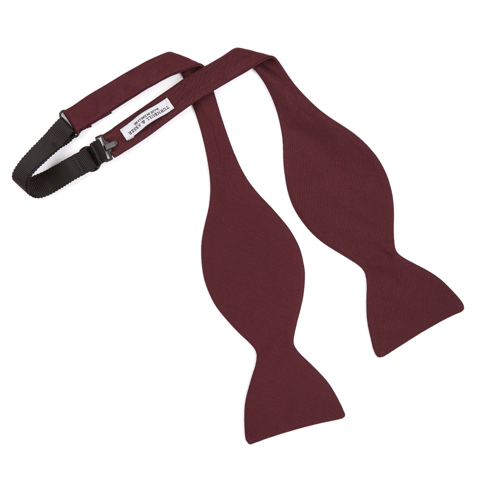 View 3 of product The Turnbull & Asser Burgundy Barathea Bow Tie, shown neatly tied with pointed ends on a white background, features smooth matte fabric for a refined formal look.