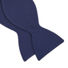 View 4 of product The Turnbull & Asser Navy Barathea Bow Tie features a classic butterfly shape in deep blue silk, ideal for formal occasions, shown against a white background.