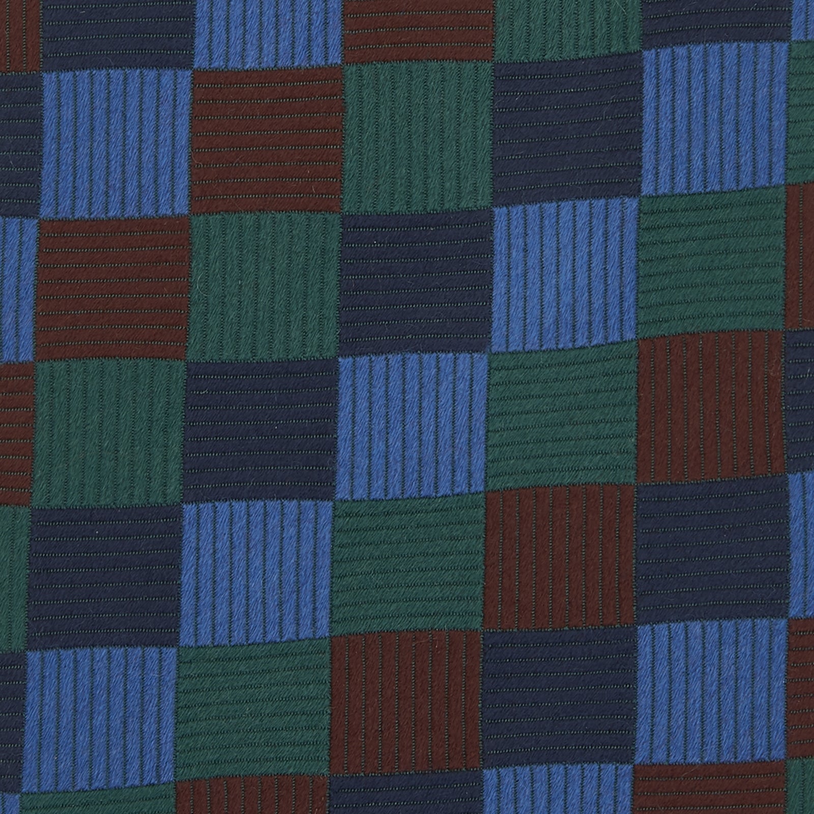 View 3 of product The Turnbull & Asser Navy and Blue Checkerboard Jacquard Wool Tie showcases a stylish checkered pattern, ideal for adding refined autumn tones to your ensemble.