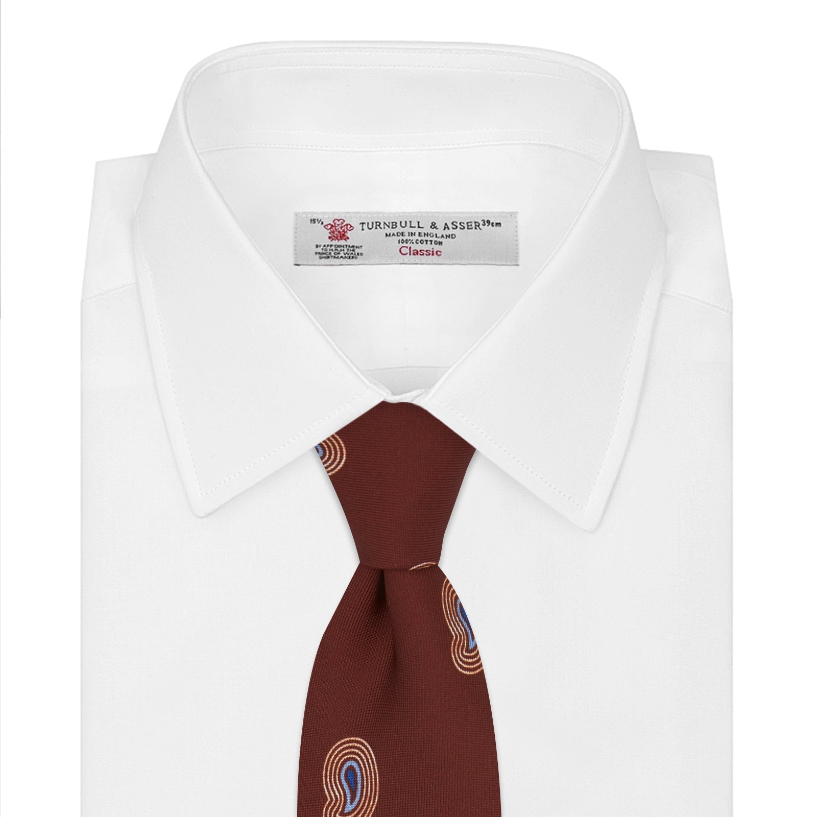 View 2 of product The Turnbull & Asser Red Pulse Paisley Silk Tie features a rolled red silk design with a repeating pattern of tan, blue, and white abstract pulse motifs.