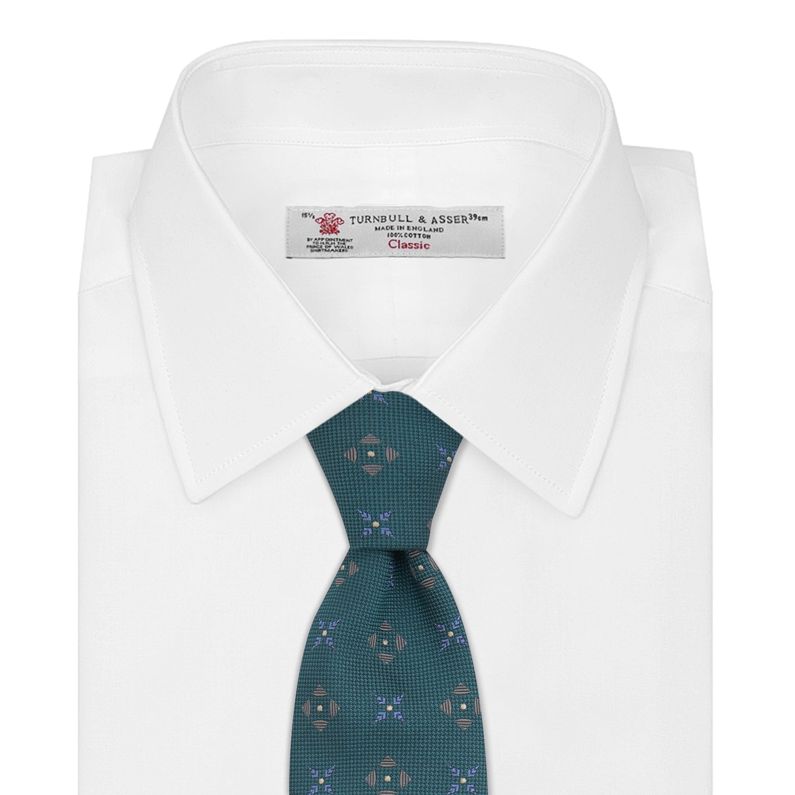 View 2 of product The Turquoise Crosses Silk Tie by Turnbull & Asser features a subtle geometric motif in tan and blue, displayed rolled on a white background—ideal for the modern office.