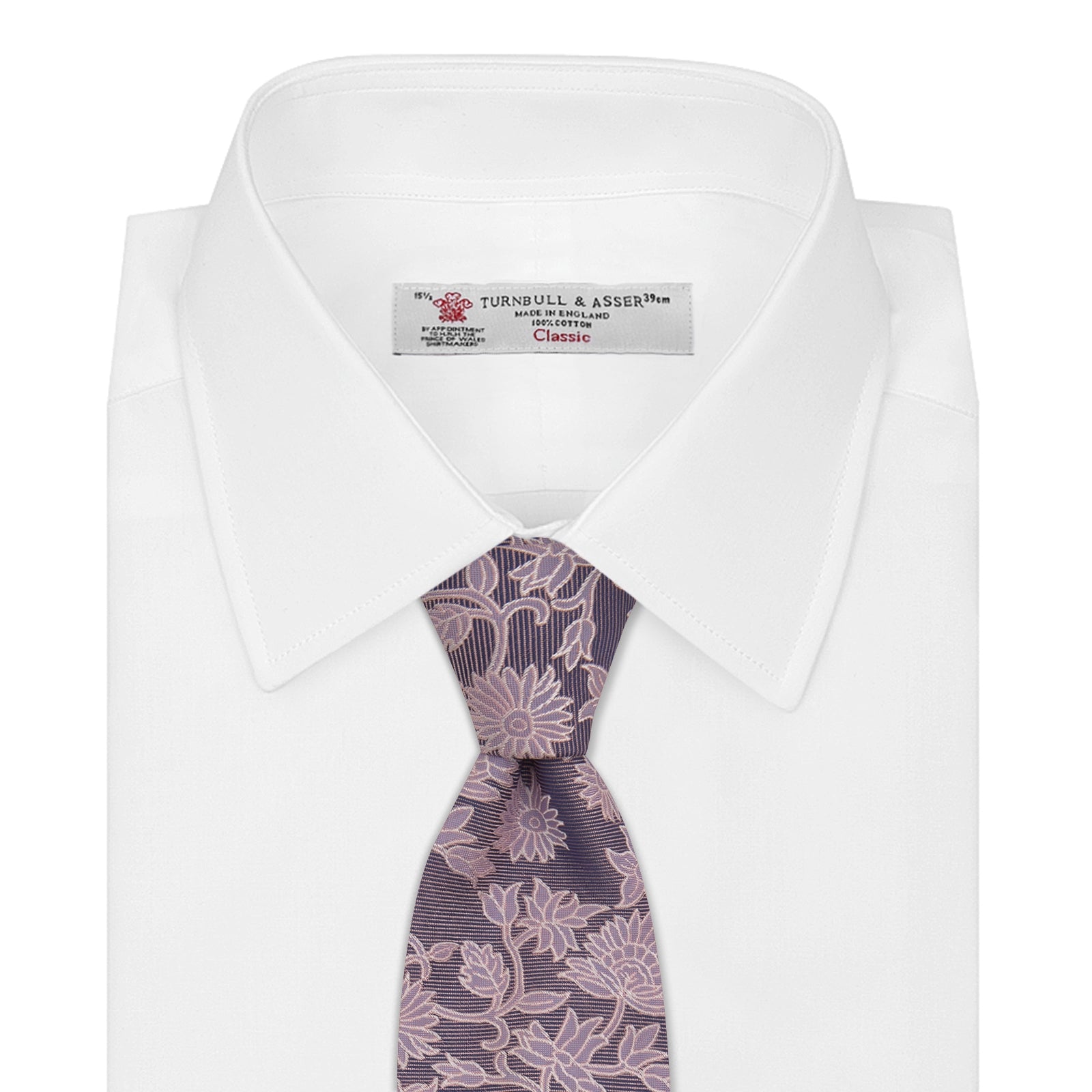 View 2 of product The Turnbull & Asser Pink Floral Occasion Silk Tie features a rolled-up purple jacquard design with a light pink floral pattern, perfect for weddings or floral events, shown on a plain white background.