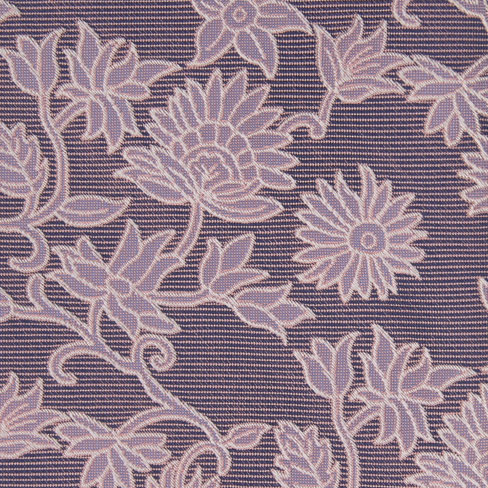 The Turnbull & Asser Pink Floral Occasion Silk Tie features a rolled-up purple jacquard design with a light pink floral pattern, perfect for weddings or floral events, shown on a plain white background.