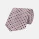 The Turnbull & Asser Pastel Pink Geometric Silk Tie features a small, repeating dark brown and white pattern for a mid-century look—ideal with tailored jackets. Shown rolled up on a white background.