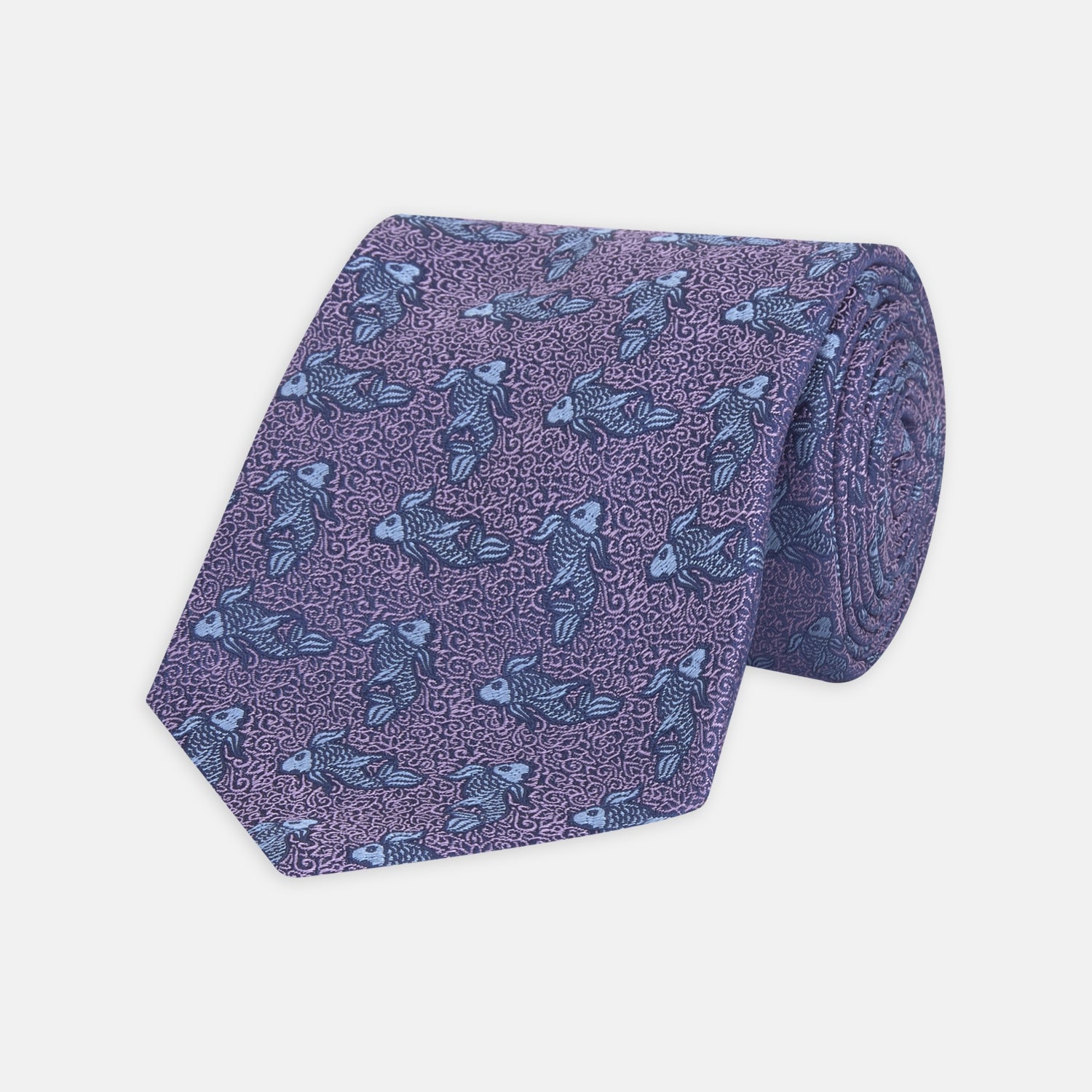 View 1 of product The Turnbull & Asser Purple Carp Silk Tie, woven in England, features blue koi fish and swirling patterns on purple silk and is shown against a plain white background.