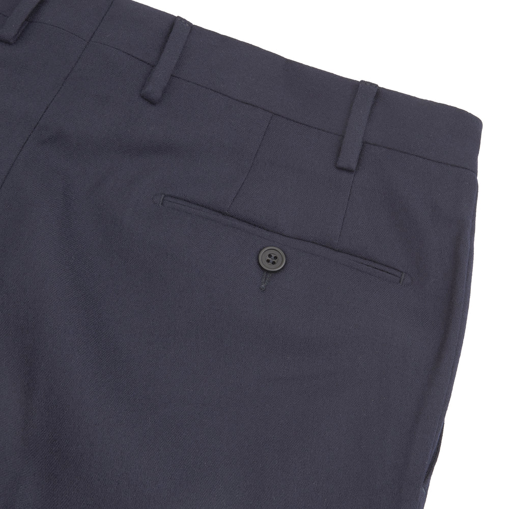The Turnbull & Asser Manson Navy Wool Serge Trousers feature a tailored, straight-leg fit with belt loops, front button, and side pockets, crafted from wool serge twill and displayed against a white background.