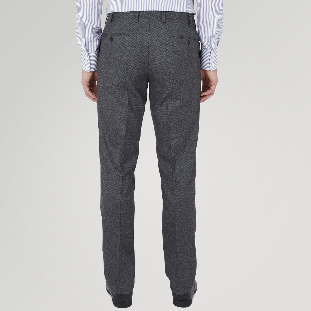 The Turnbull & Asser Jackson Grey Flannel Wool Trousers feature a tailored fit with button and zipper closure, crafted from premium wool flannel for a refined look, shown against a plain white background.