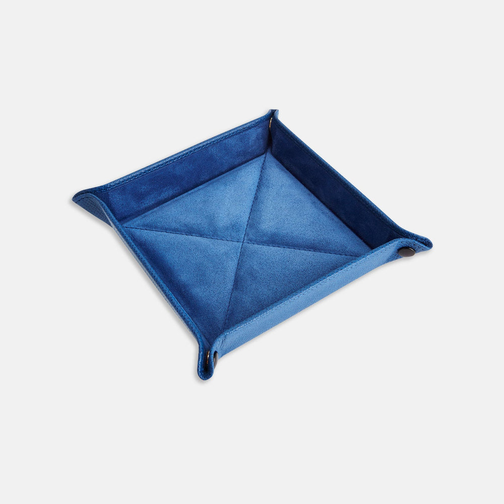 The Turnbull & Asser Royal Blue Square Leather Travel Tray, featuring raised edges and snap buttons at each corner, is ideal for organizing small accessories; shown against a plain white background.