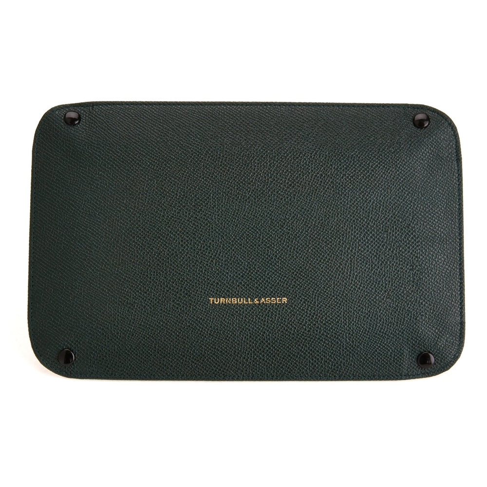 The Turnbull & Asser Dark Green and Red Rectangular Leather Travel Tray, featuring raised edges and a vibrant red suede interior, is perfect for organizing small accessories and essentials. Displayed on a white background.