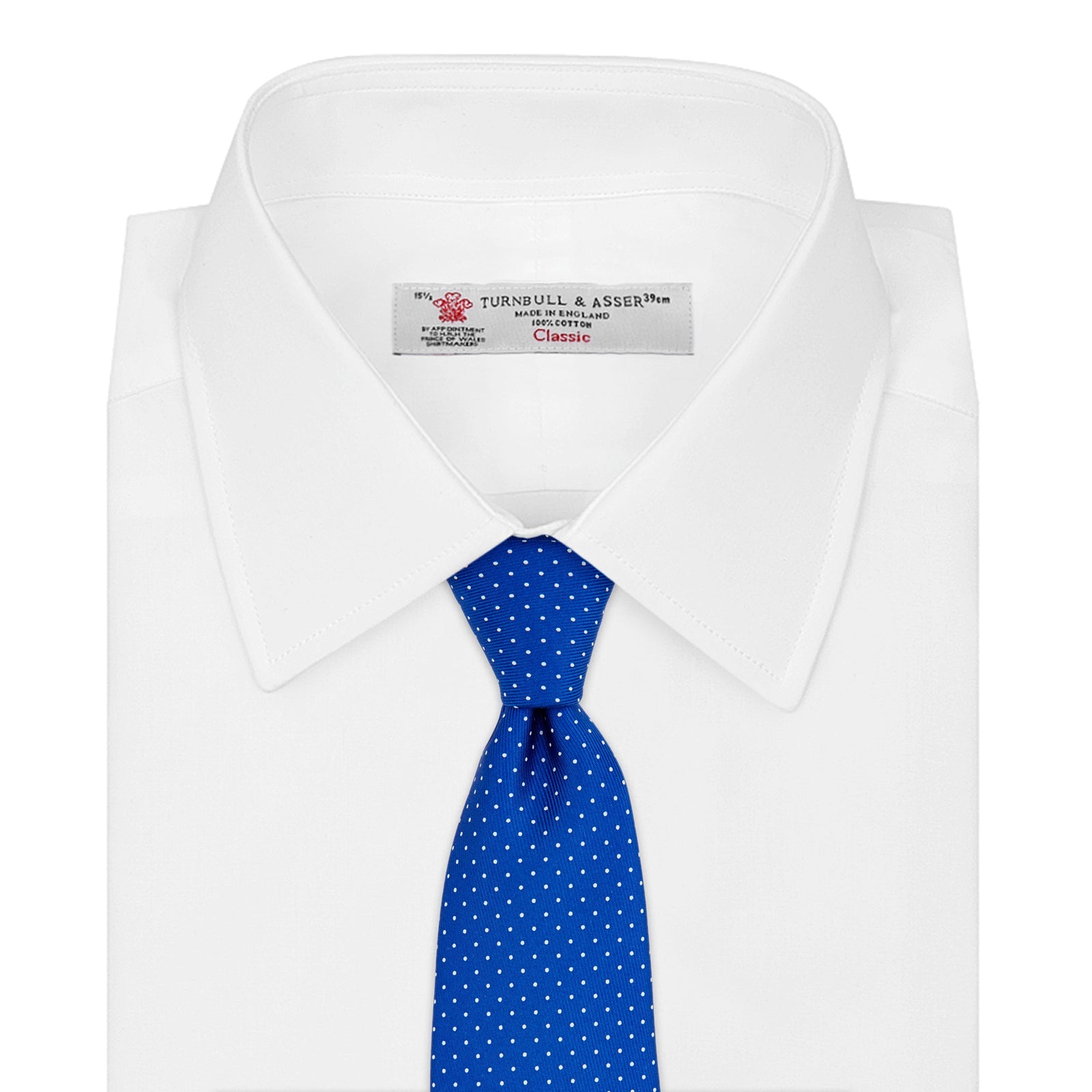 View 2 of product The Turnbull & Asser Royal Blue and White Small Spot Printed Silk Tie, shown rolled on a white background, features a refined spot pattern—ideal for complementing your office shirt.