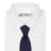 View 2 of product The Slim Navy Twill Silk Tie by Turnbull & Asser features a classic textured design—perfect with a cotton shirt—neatly displayed on a white background.